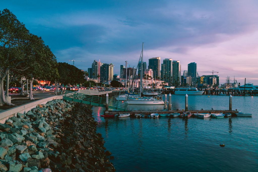 San Diego Living Highlights 22 San Diego Marine at dusk with skyline in the background - visit afinestpm.com.